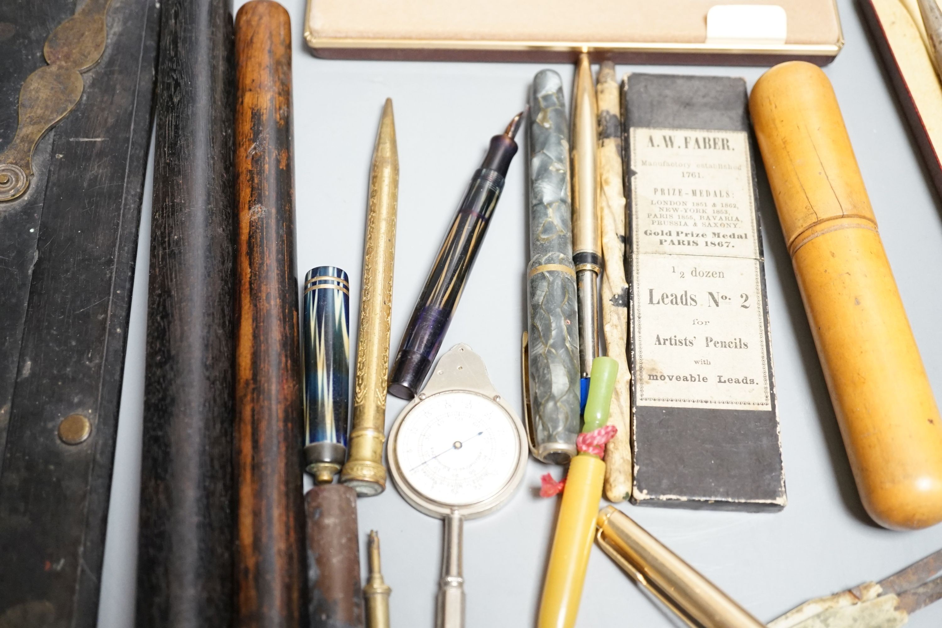 Various rules, protractors, cased spirit level etc, also to include various fountain pens, pencils